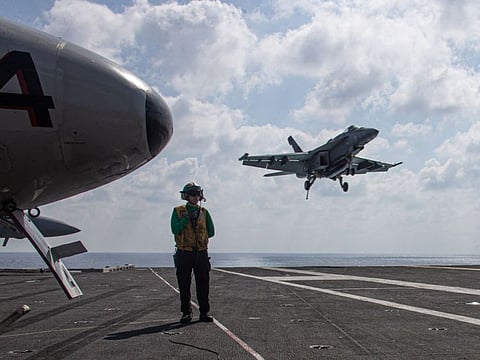 An F/A-18E Super Hornet, attached to the "Tomcatters" of Strike Fighter Squadron (VFA) 31, landing on the flight deck of the world's largest aircraft carrier USS Gerald R. Ford (CVN 78) in the Eastern Mediterranean Sea. The United States has said it fears an escalation of the war between Israel and Hamas and the prospect of Iran getting directly involved.