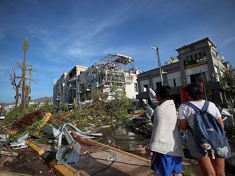 People look at damages caused by Hurricane Otis in Acapulco, Mexico, October 26, 2023.