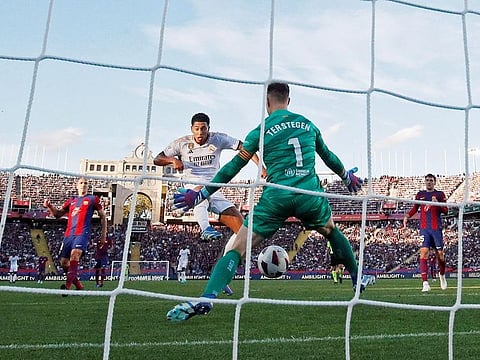 Real Madrid's Jude Bellingham scores their second goal against Barcelona.