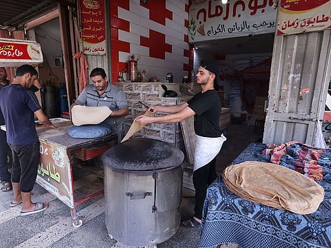 A baker prepares bread at the Rafah refugee camp, in the southern Gaza Strip.