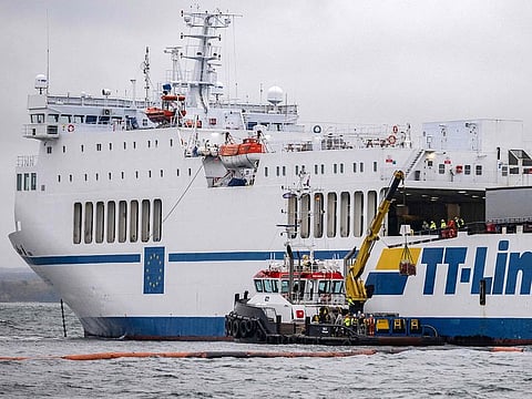 The grounded ferry Marco Polo and the tug Max are pictured during a trip with the ship KBV 314 outside Hörvik, Sweden.