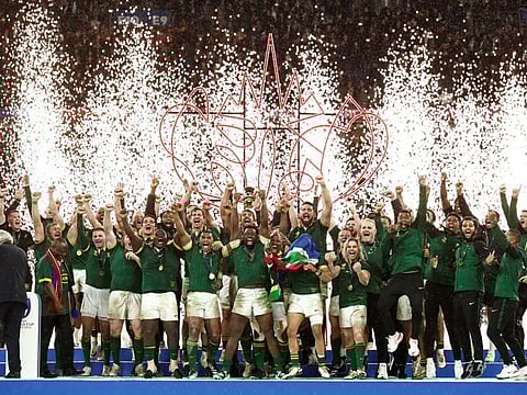 South Africa's Siya Kolisi lifts The Webb Ellis Cup as they celebrate winning the world cup final against New Zealand at Stade de France, Saint-Denis, France on Saturday.