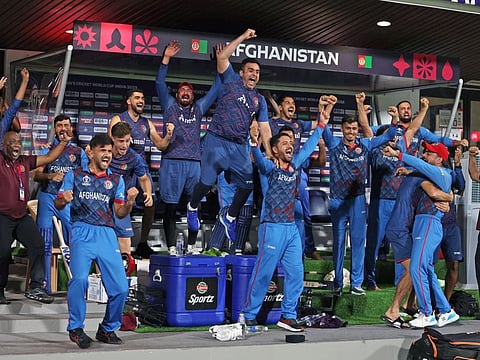 Afghanistan players celebrate the team's victory against Pakistan in the Cricket World Cup at MA Chidambaram Stadium, in Chennai.