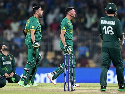 South Africa's Tabraiz Shamsi and Keshav Maharaj celebrate after their win against Pakistan at the MA Chidambaram Stadium in Chennai on October 27.