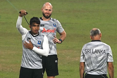 Sri Lankas Dunith Wellalage (left) attends a practice session on the eve of their World Cup match against Afghanistan at the Maharashtra Cricket Association Stadium in Pune on Sunday.