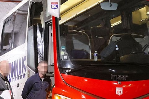 The Lyon's team bus with one window completely broken and another damaged after the bus was stoned as it entered the Stade Velodrome ahead of the French L1 match against Olympique Marseille.