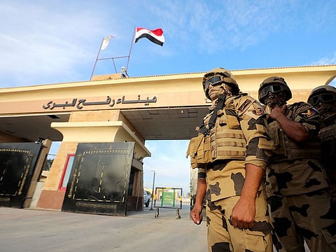 Military personnel stand guard on the Rafah border crossing between Egypt and the Gaza Strip.