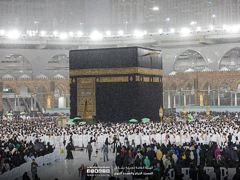 Pilgrims perform Umrah at the Grand Mosque in Mecca during rain on Sunday.