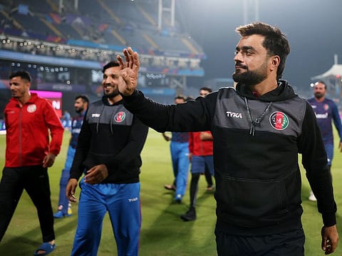 Afghanistan's Rashid Khan and Gulbadin Naib celebrate after winning the match against Sri Lanka in Pune on Monday.