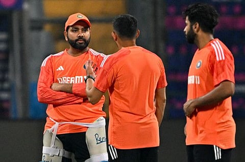India's captain Rohit Sharma speaks with teammates during a practice session on the eve of their Cricket World Cup match against Sri Lanka at the Wankhede Stadium in Mumbai on Wednesday.