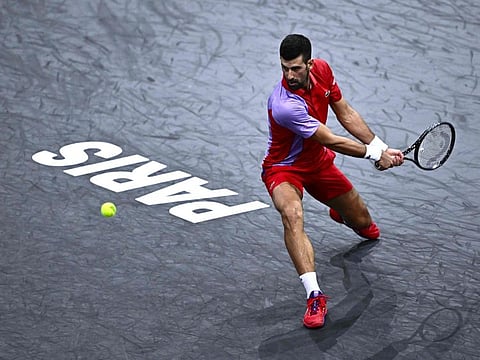 Serbia's Novak Djokovic plays a backhand return to Argentina's Tomas Martin Etcheverry during their men's singles match at the Accor Arena in Paris on Wednesday.