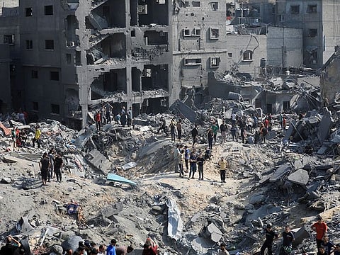 Palestinians search for casualties a day after Israeli strikes on houses in Jabalia refugee camp in the northern Gaza Strip.