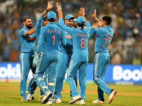 India’s players celebrate after the dismissal of Sri Lanka’s Charith Asalanka during their World Cup match at the Wankhede Stadium on Thursday. India won the clash by a 302-run margin.