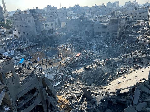 Palestinians gather at the site of Israeli strikes on houses in Jabaliya refugee camp in the northern Gaza Strip, November 1, 2023.