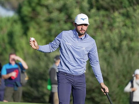 England's Marco Penge holing his birdie putt on the 17th hole
