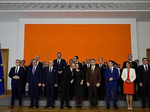 Croatian Foreign Minister Gordan Grlic-Radman attempts to give German Foreign Minister Annalena Baerbock a kiss as the pose for a family photo during a Ministerial Conference on the issues of EU enlargement, EU reforms and the EU's global capacity at the Federal Foreign Office in Berlin on November 2, 2023.
