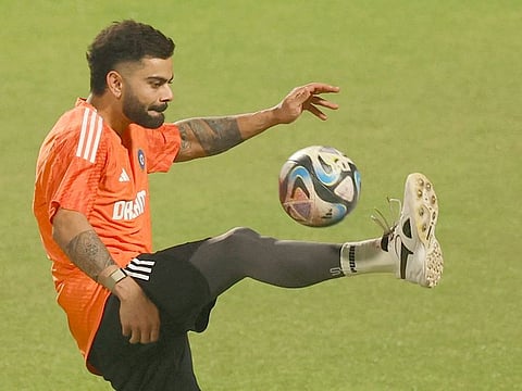 India's Virat Kohli plays football during a practice session at Eden Gardens, Kolkata, on Saturday.
