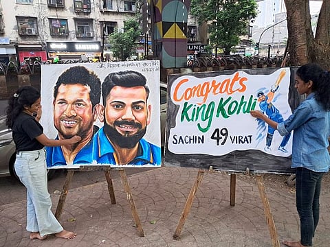 Gurukul School Of Art Students with their paintings congratulating Virat Kohli on his 49th ODI century during the match against South Africa in the World Cup, in Mumbai on Sunday.