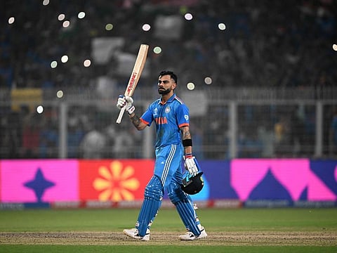 India's Virat Kohli celebrates after scoring a century during the Cricket World Cup match against South Africa at the Eden Gardens in Kolkata on Sunday.