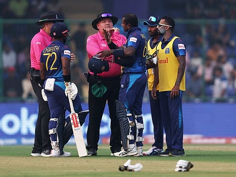 Sri Lanka's Angelo Mathews speaks to the umpires after losing his wicket due to time out during the World Cup match against Bangladesh at Arun Jaitley Stadium in New Delhi on Monday.