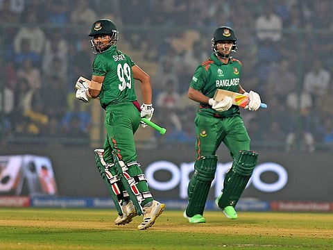 Bangladesh's Shakib Al Hasan and Najmul Hossain Shanto run between the wickets during the match against Sri Lanka at Arun Jaitley Stadium in New Delhi on Monday.