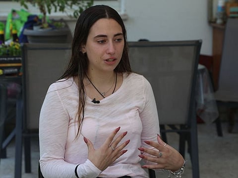 Shavit Irene, girlfriend of 21-year-old Israeli citizen Netta Epstein who died when he jumped on a grenade during the October 7 attack in southern Israel gives an interview at her house in the village of Bitzaron near the city of Ashdod on November 3, 2023.