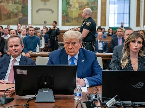 Former U.S. President Donald Trump (C) prepares to testify during his trial in New York State Supreme Court on November 06, 2023 in New York City.