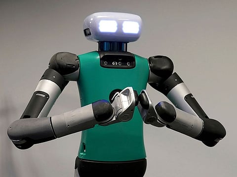 Agility Robotics' robot Digit performs gestures at the company's office in Pittsburgh.