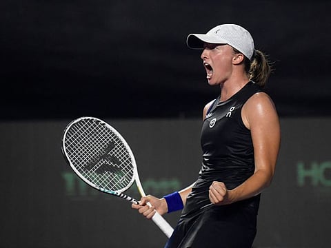 Poland's Iga Swiatek celebrates after defeating Belarus' Aryna Sabalenka during their women's singles semifinal at the WTA Finals Championship in Cancun on Sunday.
