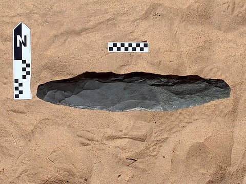 The axe made from durable soft basalt stone measures 51.3cm in length.