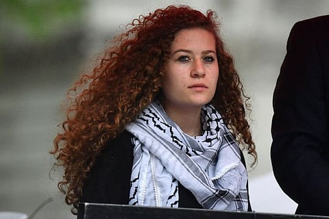 Palestinian activist Ahed Tamimi waits to speak at a rally calling for justice for Palestinians amid a growing threat of further war in the Middle East, in central London on May 11, 2019.