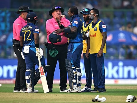 Sri Lanka's Angelo Mathews speaks with the umpires after he was timed out during the World Cup match against Bangladesh at the Arun Jaitley Stadium in New Delhi on Monday.