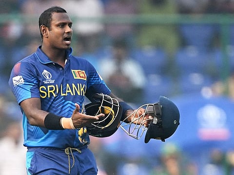 Sri Lanka's Angelo Mathews reacts after he was timed out during the 2023 ICC Men's Cricket World Cup match against Bangladesh at the Arun Jaitley Stadium in New Delhi on November 6, 2023.