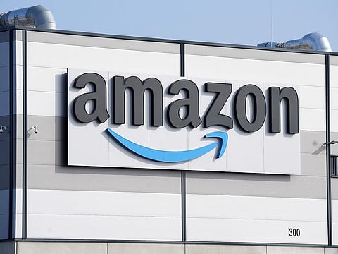 An Amazon company logo is seen on the facade of a company's building in Schoenefeld near Berlin, Germany.