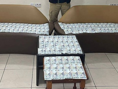 Police display the recovered cash