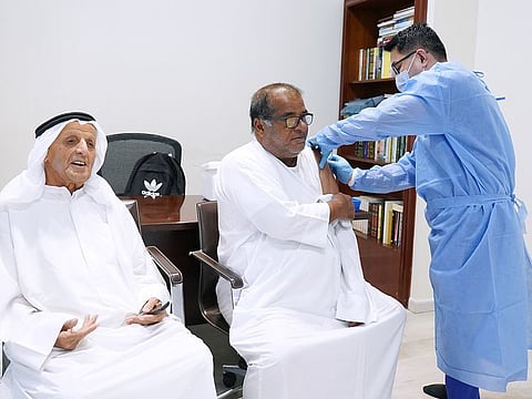 Elderly people getting a flu shot in Dubai. Dr. Butti Al Suwaidi, Public Health Specialist at the Dubai Health Authority, urged individuals in the community to take the initiative to receive the influenza vaccine, especially those who are at higher risk of infection and its complications.