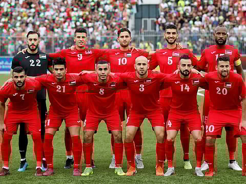 FIFA World Cup 2022 and Asian Cup Qualifier Palestine’s players pose for a team group photo before the match.