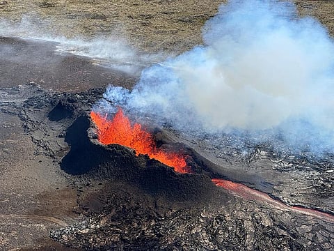 File photo: Lava spurts and flows after the eruption of a volcano in the Reykjanes Peninsula, Iceland, on July 12, 2023.