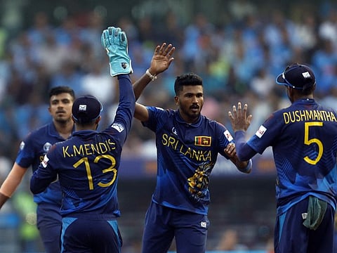 Sri Lanka's Kusal Mendis celebrates with Dushmantha Chameera after taking a catch to dismiss India's Suryakumar Yadav off the bowling of Dilshan Madushanka.