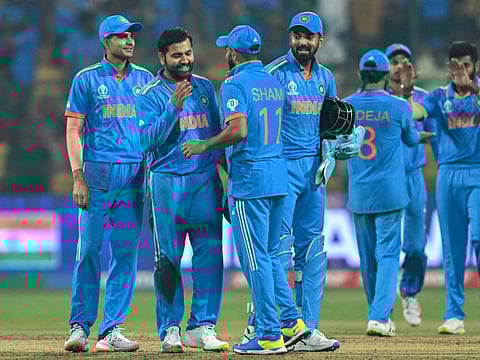 India's players celebrate their win at the end of the World Cup match against Netherlands at the M. Chinnaswamy Stadium in Bengaluru on Sunday.