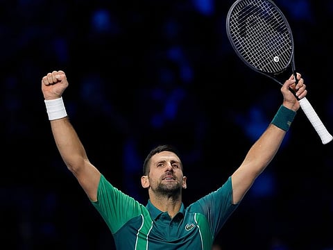 Serbia's Novak Djokovic celebrates after winning the singles tennis match against Denmark's Holger Rune, of the ATP World Tour Finals at the Pala Alpitour, in Turin, Italy,