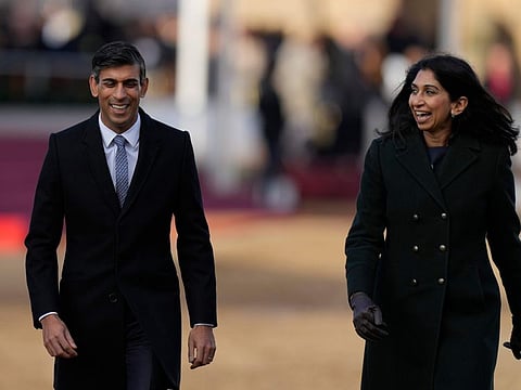 Britain's Prime Minister Rishi Sunak, left, and Suella Braverman at the ceremonial welcome for the President of South Africa Cyril Ramaphosa at Horse Guards Parade in London on November 22, 2022.