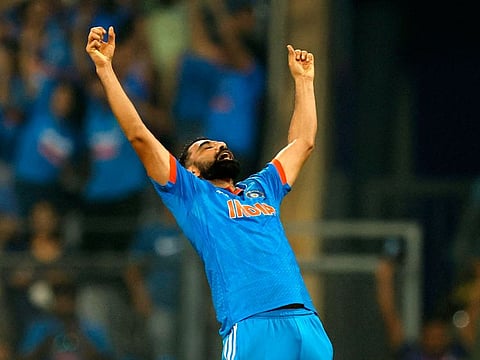 India’s Mohammed Shami celebrates after taking the wicket of New Zealand's Daryl Mitchell, caught out by Ravindra Jadeja. Shami finished with a haul of 7-57 as India won by 70 runs and marched into Sunday’s final at the Narendra Modi Stadium in Ahmedabad, India.