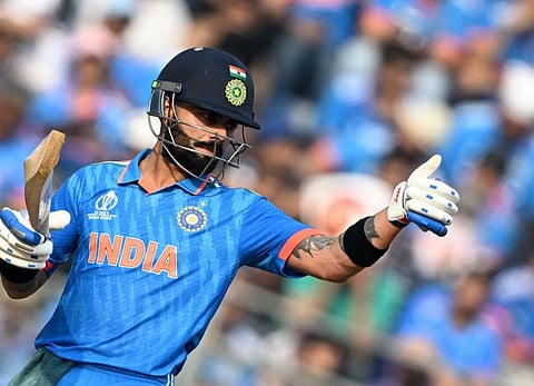 India's Virat Kohli gestures after reaching his half-century against New Zealand in the Cricket World Cup semi-finals in Mumbai on Wednesday.