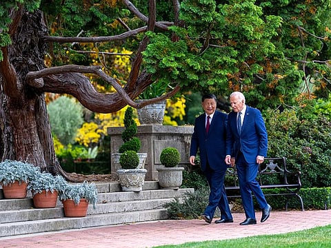 President Joe Biden and China's President President Xi Jinping walk in the gardens at the Filoli Estate in Woodside, Calif., Wednesday, Nov, 15, 2023, on the sidelines of the Asia-Pacific Economic Cooperative conference.