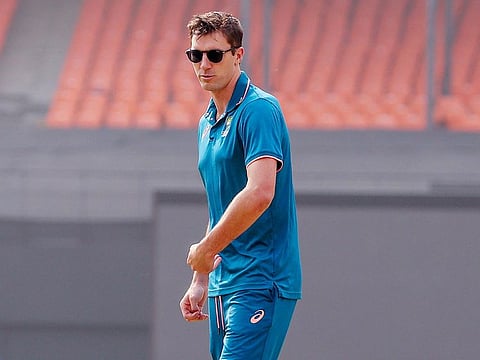 Australia Captain Pat Cummins inspects the pitch ahead of the ICC Men's Cricket World Cup 2023 final match against India, at Narendra Modi Stadium in Ahmedabad on Saturday.