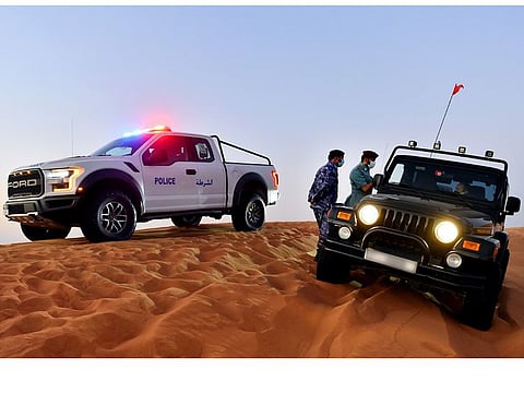 File photo of a desert patrol from Sharjah Police interacting with an off-road enthusiast. Image used for illustrative purpose only.