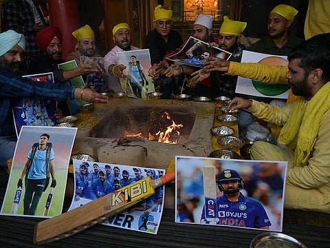 Fans offer prayers for team India's victory at a temple in Amritsar