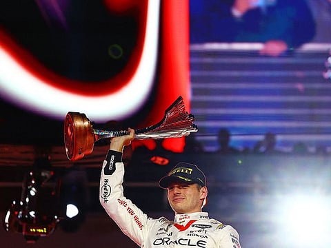 Race winner Max Verstappen of the Netherlands and Oracle Red Bull Racing celebrates on the podium during the F1 Grand Prix of Las Vegas at Las Vegas Strip Circuit.