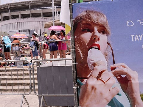 Taylor Swift fans wait for the doors of Nilton Santos Olympic stadium to open for her Eras Tour concert amid a heat wave in Rio de Janeiro, Brazil.